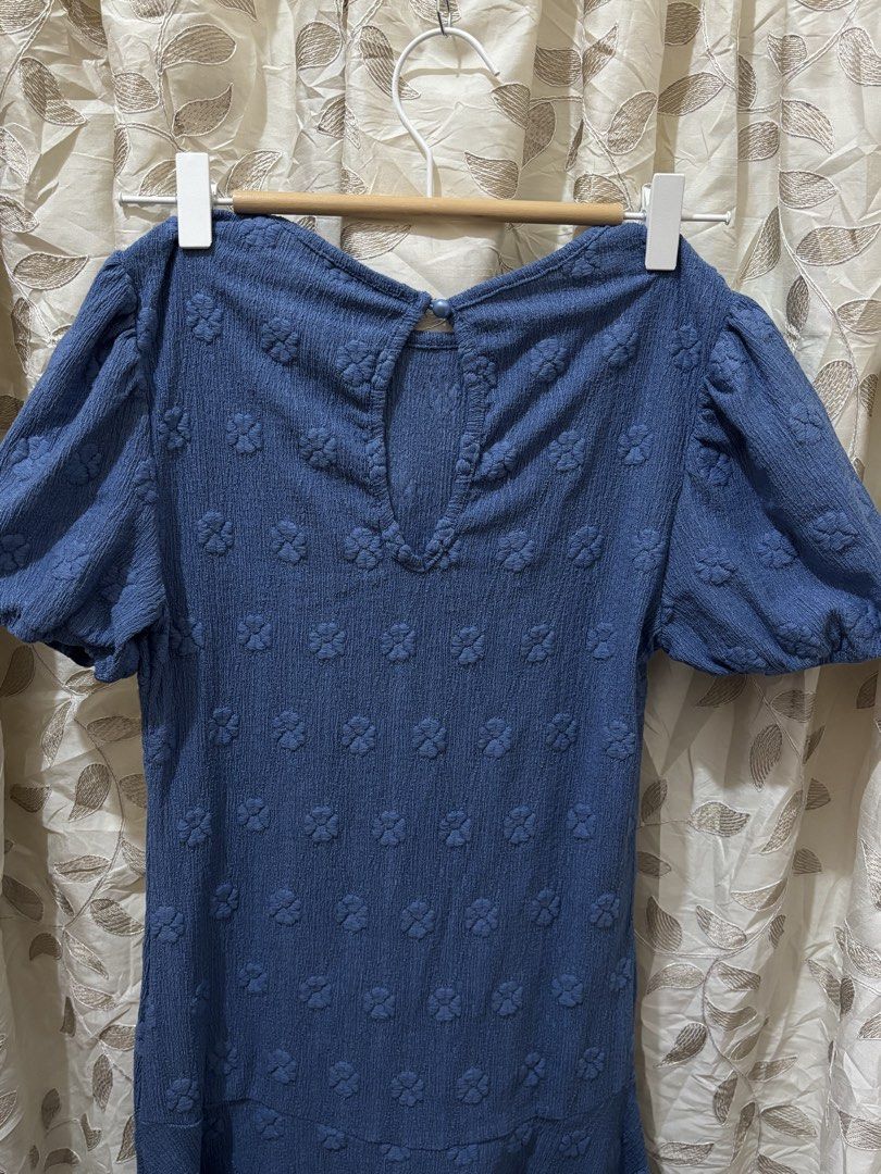 Blue Floral Midi Dress (Category: Dresses) located in Baguio. Submitted by ravendoll.ph (Listing ID 1434475105, Image 3). Description: - Light blue midi dress - Unique floral pattern - Short puff sleeves - Round neckline - Keyhole back detail - Asymmetrical hemline.