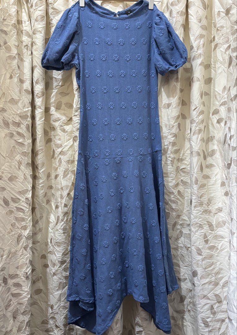 Blue Floral Midi Dress (Category: Dresses) located in Baguio. Submitted by ravendoll.ph (Listing ID 1434475105, Image 2). Description: - Light blue midi dress - Unique floral pattern - Short puff sleeves - Round neckline - Keyhole back detail - Asymmetrical hemline.