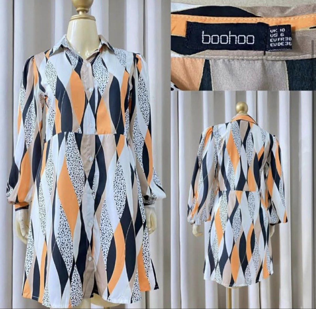 Boohoo Geometric Print Dress (Category: Dresses) located in Cebu City. Submitted by nikkady (Listing ID 1434537212, Image 1). Description: - Boohoo dress with a unique geometric print. - Colors: Orange, black, and white. - Features a collared neckline and long sleeves. - Button-down front. - Size: UK 10 / US 6 / EUR 38. - Flattering fit. - Perfect for a stylish and comfortable look..
