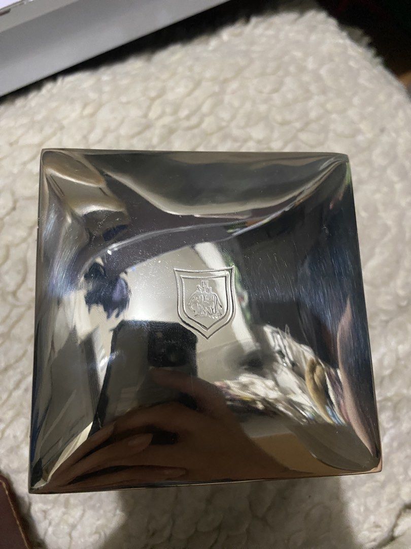 Boreas Silver-Plated Luxury Tea Caddy from Newby Teas. (Category: Coffee & Tea Tableware) located in Manila. Submitted by kulabostor44357 (Listing ID 1434395612, Image 3). Description: - Newby London tea caddy - Black exterior with gold lettering - Silver-toned interior - Decorative silver lid with purple backing - Silver emblem on the bottom - Ideal for tea enthusiasts and collectors.