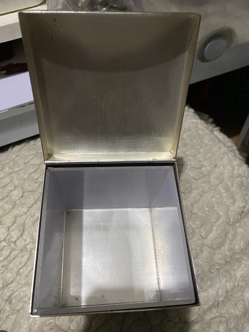 Boreas Silver-Plated Luxury Tea Caddy from Newby Teas. (Category: Coffee & Tea Tableware) located in Manila. Submitted by kulabostor44357 (Listing ID 1434395612, Image 2). Description: - Newby London tea caddy - Black exterior with gold lettering - Silver-toned interior - Decorative silver lid with purple backing - Silver emblem on the bottom - Ideal for tea enthusiasts and collectors.