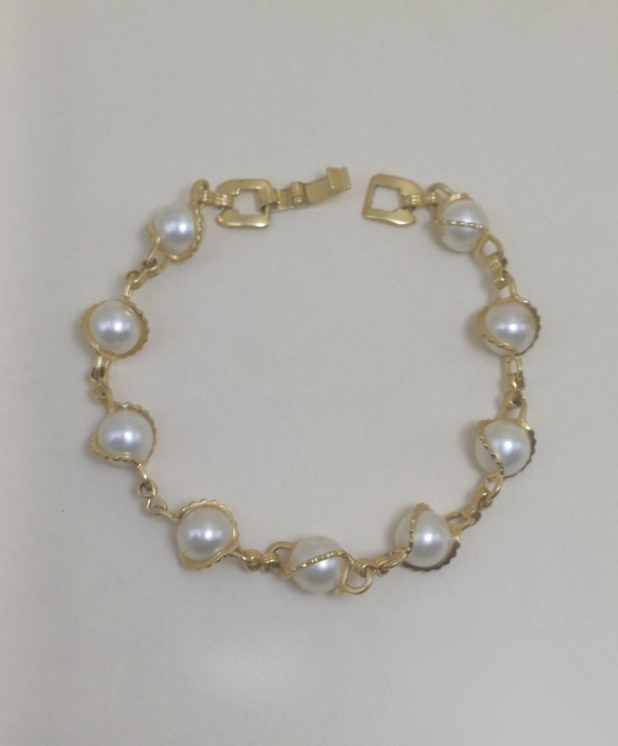 Bracelet 587 (GIOIELLI) (Category: Bracelets) located in Cebu City. Submitted by tea_pr (Listing ID 1434406584, Image 3). Description: 1 pc. available Very minor scratches on some pearl-like beads and lock/clasp Length (unclasped): 20 cm (approx.) RFS: Decluttering Delivery/shipping fee to be shouldered by buyer. Modes of payment: Gcash, PayPal, or online bank transfer.