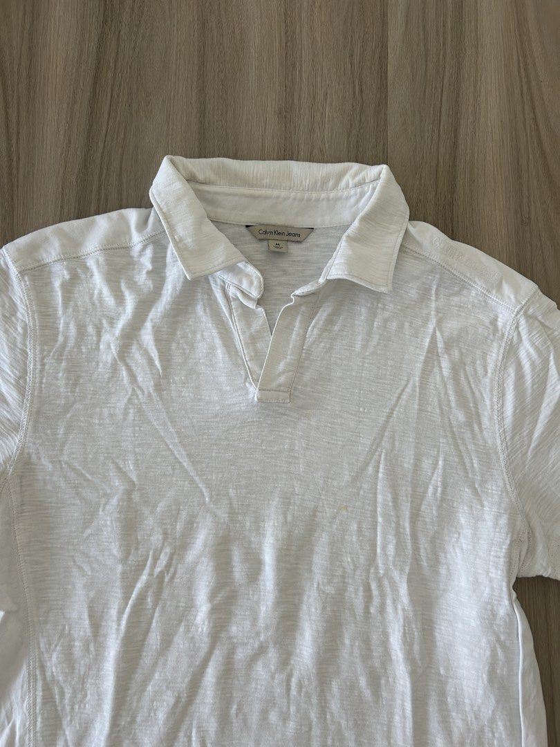 Calvin Klein White Polo Shirt (Category: Tshirts & Polo Shirts ) located in Taguig. Submitted by prelovedcloset2 (Listing ID 1434414658, Image 2). Description: - Calvin Klein Jeans polo shirt - Size: M - With some stains - see photos .