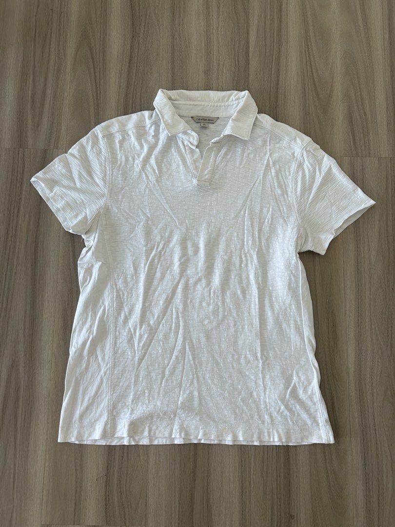 Calvin Klein White Polo Shirt (Category: Tshirts & Polo Shirts ) located in Taguig. Submitted by prelovedcloset2 (Listing ID 1434414658, Image 1). Description: - Calvin Klein Jeans polo shirt - Size: M - With some stains - see photos .