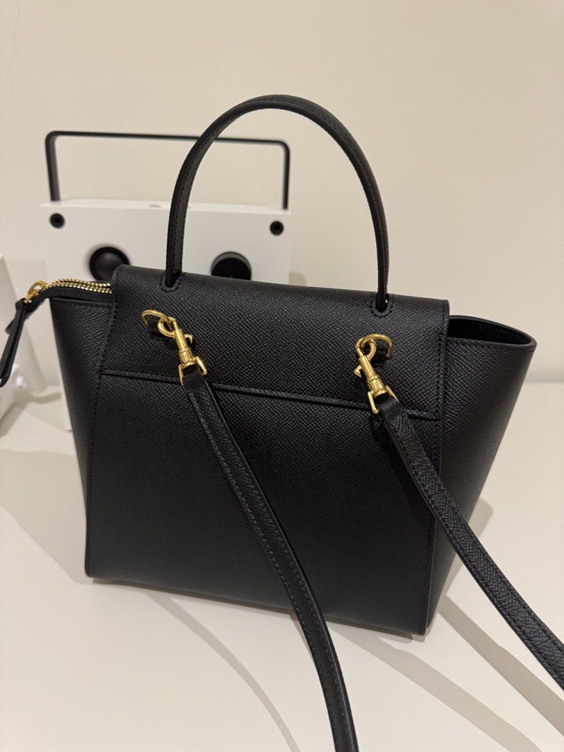 Celine Nano Belt Bag - Pristine condition & full set (Category: Bags & Wallets) located in Kuala Lumpur. Submitted by eshiang (Listing ID 1434519374, Image 2). Description: - Authentic Celine Belt Bag - Color: Black - Bought in New Jersey, US (Nov 2025) - Hardware: Gold-tone - Features: - Top handle - Detachable shoulder strap - Interior zipped pocket - Flap closure with knot detail - Zipper closure - Interior lined with soft material - Comes in 