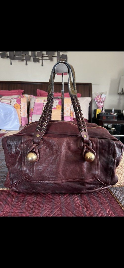 CHLOE Leather Handbag with Braided Straps (Category: Luxury Bags & Wallets) located in Cabanatuan. Submitted by prelovedtrinkets2023 (Listing ID 1434508508, Image 1). Description: - OG Burgundy leather handbag - Braided straps - Zippered closure - Gold-toned hardware - Spacious interior - Classic design - Suitable for everyday use.