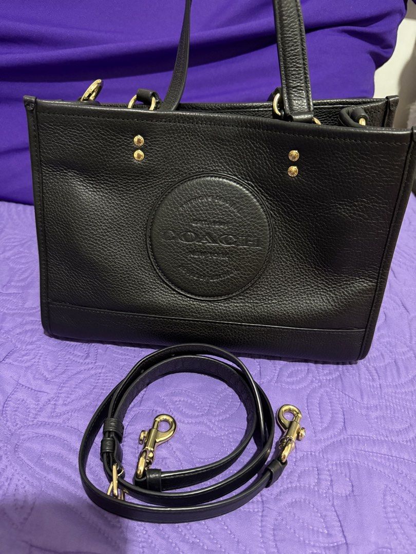 Coach Dempsey Carryall Bag (Category: Luxury Bags & Wallets) located in Dasmarinas. Submitted by prinsesitah_ (Listing ID 1434526658, Image 1). Description: Coach Dempsey Carryall Fresh and Excellent condition 9/10 Clean inside and out Gold hardwares with long strap 100% original Actual photos posted 6000 pesos only Sure buyers pm me for more details Can do meet up within Dasmariñas Cavite or Alabang/ San Pedro Laguna (by schedule) Can ship via L