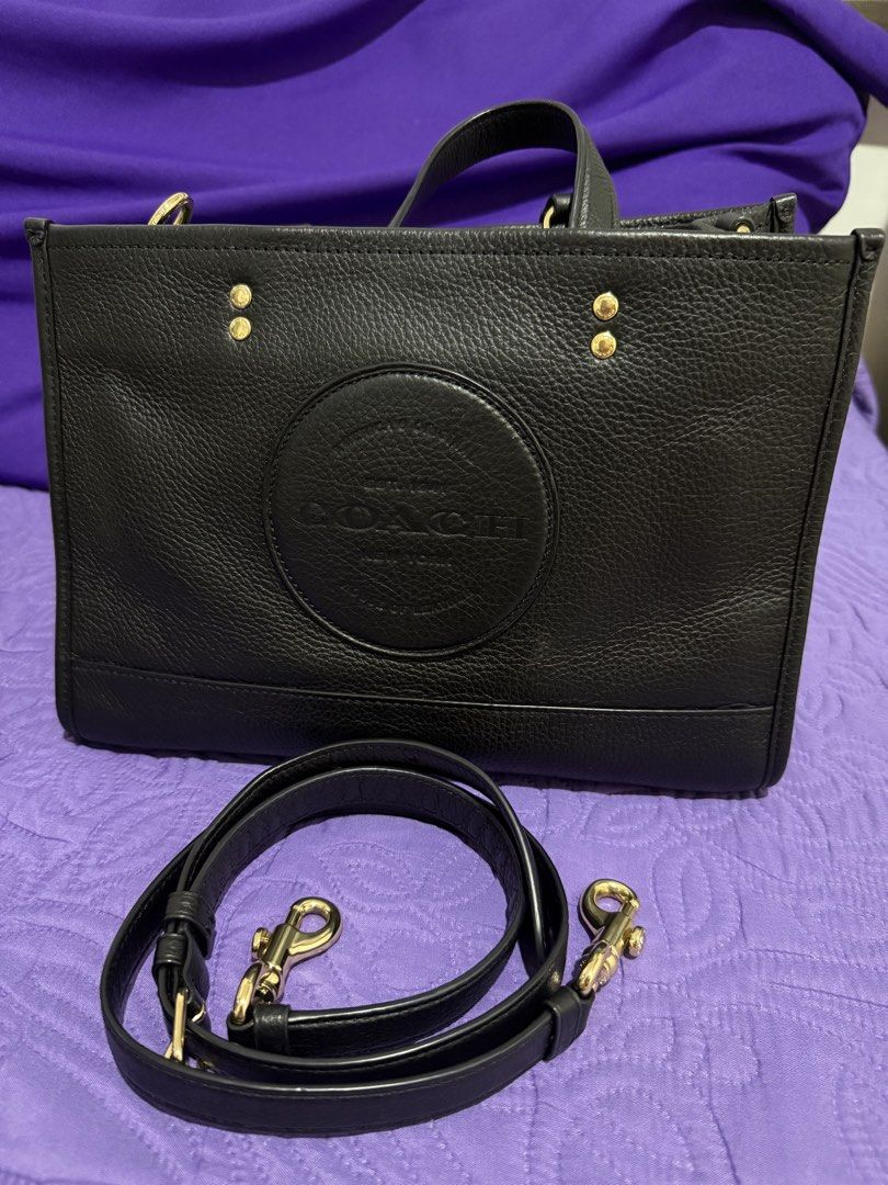 Coach Dempsey Carryall Bag (Category: Luxury Bags & Wallets) located in Dasmarinas. Submitted by prinsesitah_ (Listing ID 1434526658, Image 2). Description: Coach Dempsey Carryall Fresh and Excellent condition 9/10 Clean inside and out Gold hardwares with long strap 100% original Actual photos posted 6000 pesos only Sure buyers pm me for more details Can do meet up within Dasmariñas Cavite or Alabang/ San Pedro Laguna (by schedule) Can ship via L