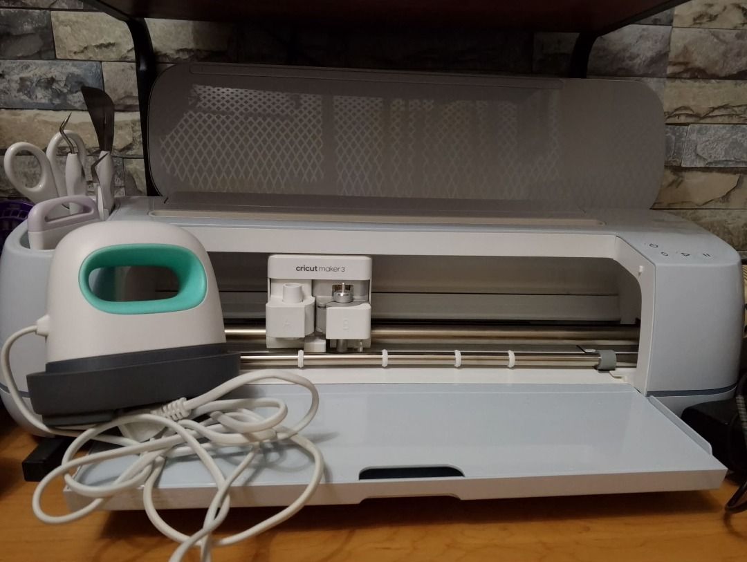 Cricut Maker 3 with Crafting tools and Mini Press (Category: Craft Supplies & Tools) located in Caloocan City. Submitted by vasteagle_76a855 (Listing ID 1434535099, Image 1). Description: - Cricut Maker 3 cutting machine (white body, gray base) - EasyPress Mini (white with teal handle) - Crafting tool set - Ideal for various crafting projects .