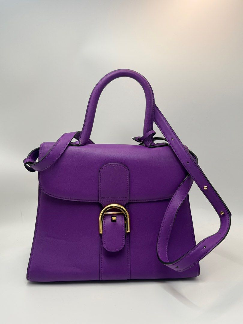 Delvaux Brillant bag (Category: Cross-body Bags) located in Caloocan City. Submitted by rossvault2 (Listing ID 1434543530, Image 1). Description: - Delvaux Brillant Mini handbag - Stunning purple color - Top handle and detachable shoulder strap - Gold-tone buckle closure and hardware - Interior zippered pocket - Made in France -coded white tag -ukay source pls manage ur expectations -normal signs of use.