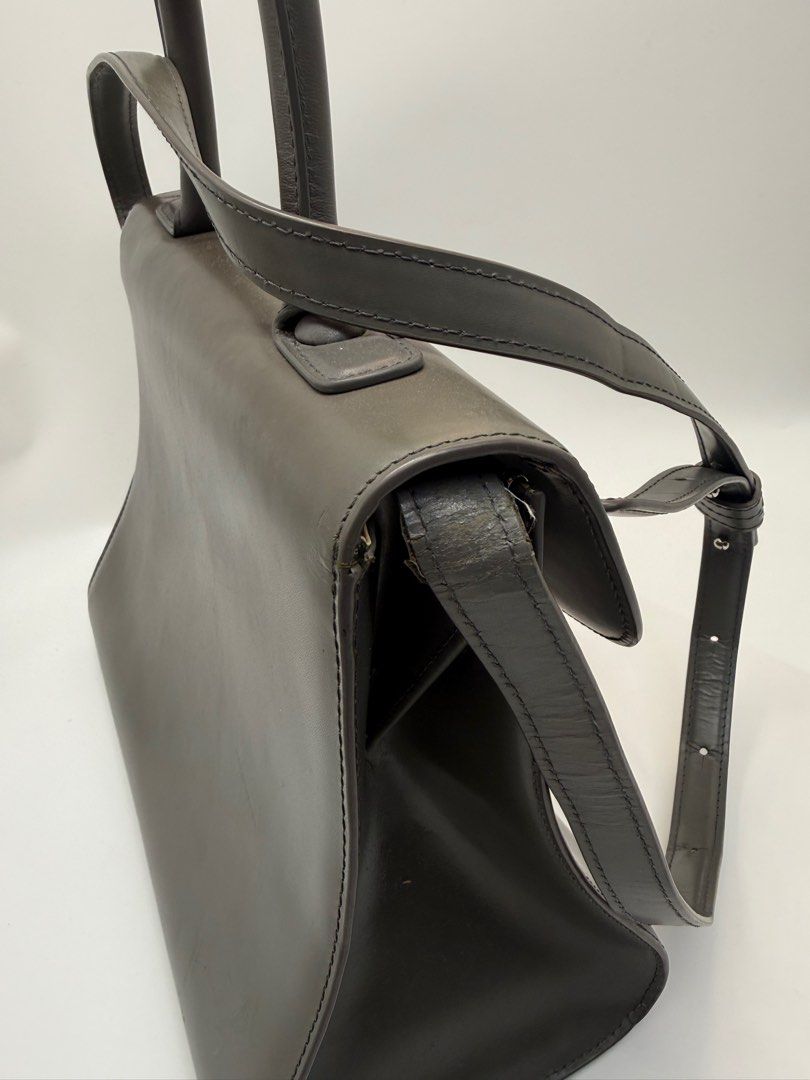 Delvaux Grey Leather bag (Category: Cross-body Bags) located in Caloocan City. Submitted by rossvault2 (Listing ID 1434533922, Image 3). Description: - Delvaux grey leather handbag - Top handle and detachable shoulder strap - Silver buckle closure - Interior with zippered pocket and compartments - Made in France - Minor wear on strap -coded/white tag -ukay source pls manage ur expectations -normal signs of use -sobrang kapal and structured .