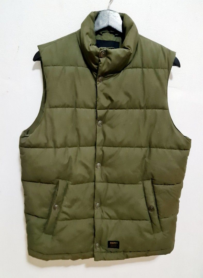 Deus Ex Machina Men's Carson Green Puffer Vest(Size M) (Category: Men's Clothes) located in Sydney. Submitted by desirably (Listing ID 1434483703, Image 1). Description: Deus Ex Machina Men's Carson Green Puffer Vest(Size M) for $85. Worn very lightly&in excellent condition - nice, comfy and super warm! Stand collar Zip and snap button closure Jet pockets 72% cotton, 28% polyamide fabrication with enzyme wash 100% cotton lining 100% Polyester pad