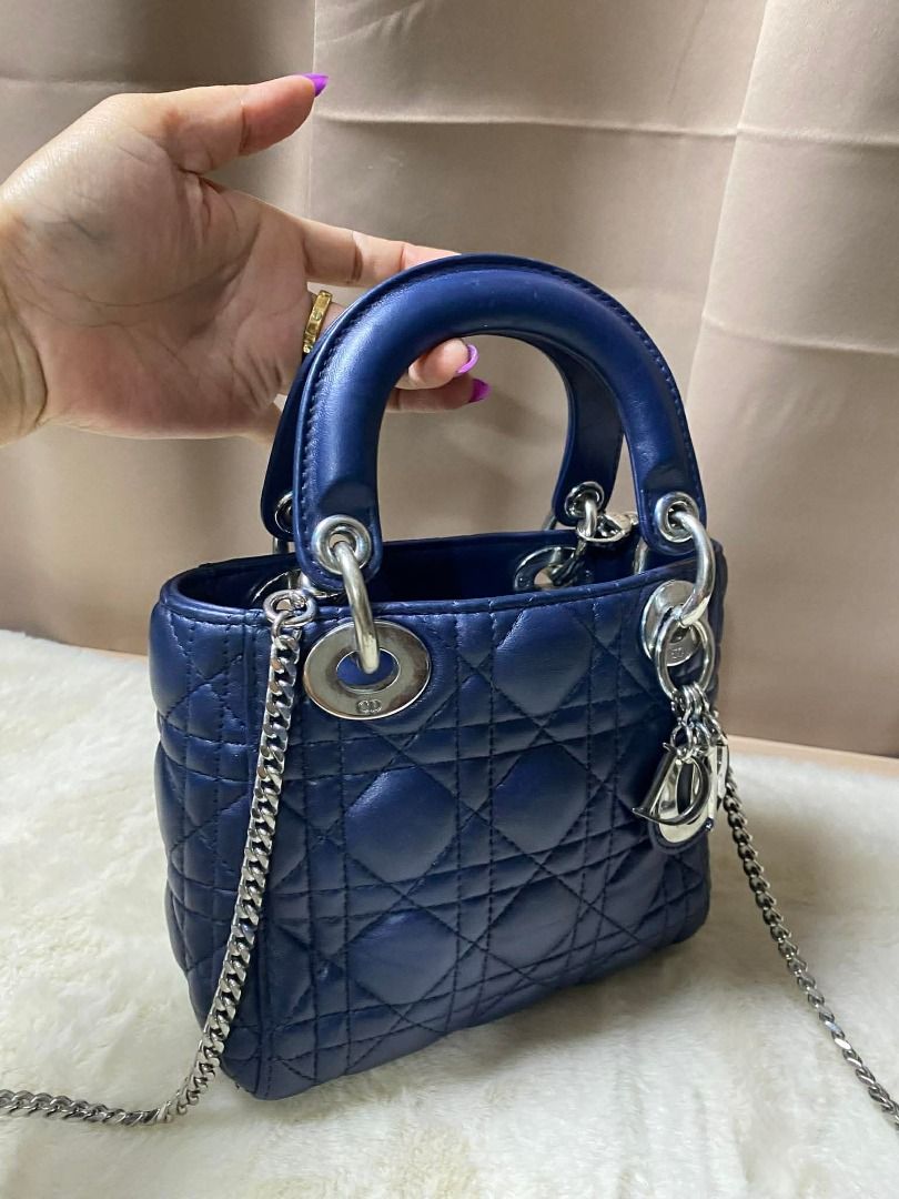 Dior Lady Dior Mini Bag Navy Blue hb (Category: Luxury Bags & Wallets) located in Caloocan City. Submitted by bolddragon-556c53 (Listing ID 1434572879, Image 3). Description: - Authentic Lady Dior Mini Bag - Navy blue quilted leather - Top handle and detachable chain strap - Silver-tone hardware - Interior with zip pocket - Made in Italy.