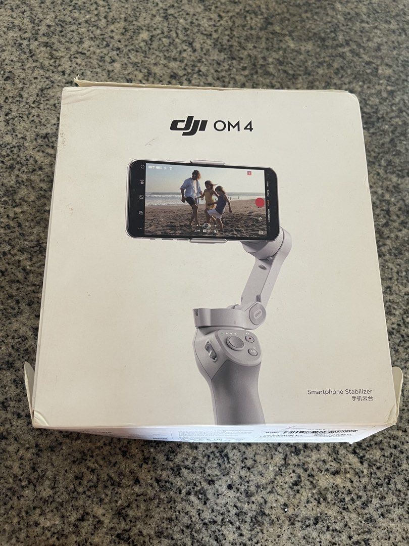 DJI OM 4 Smartphone Stabilizer (Category: Gimbals & Stabilizers ) located in Taguig. Submitted by supplementary (Listing ID 1434431525, Image 1). Description: DJI OM 4 smartphone stabilizer. Includes the stabilizer itself, a grip, and a wrist strap. The box is included. The stabilizer is designed to stabilize your smartphone for smooth video recording. It is a great tool for capturing high-quality videos and photos on the go..