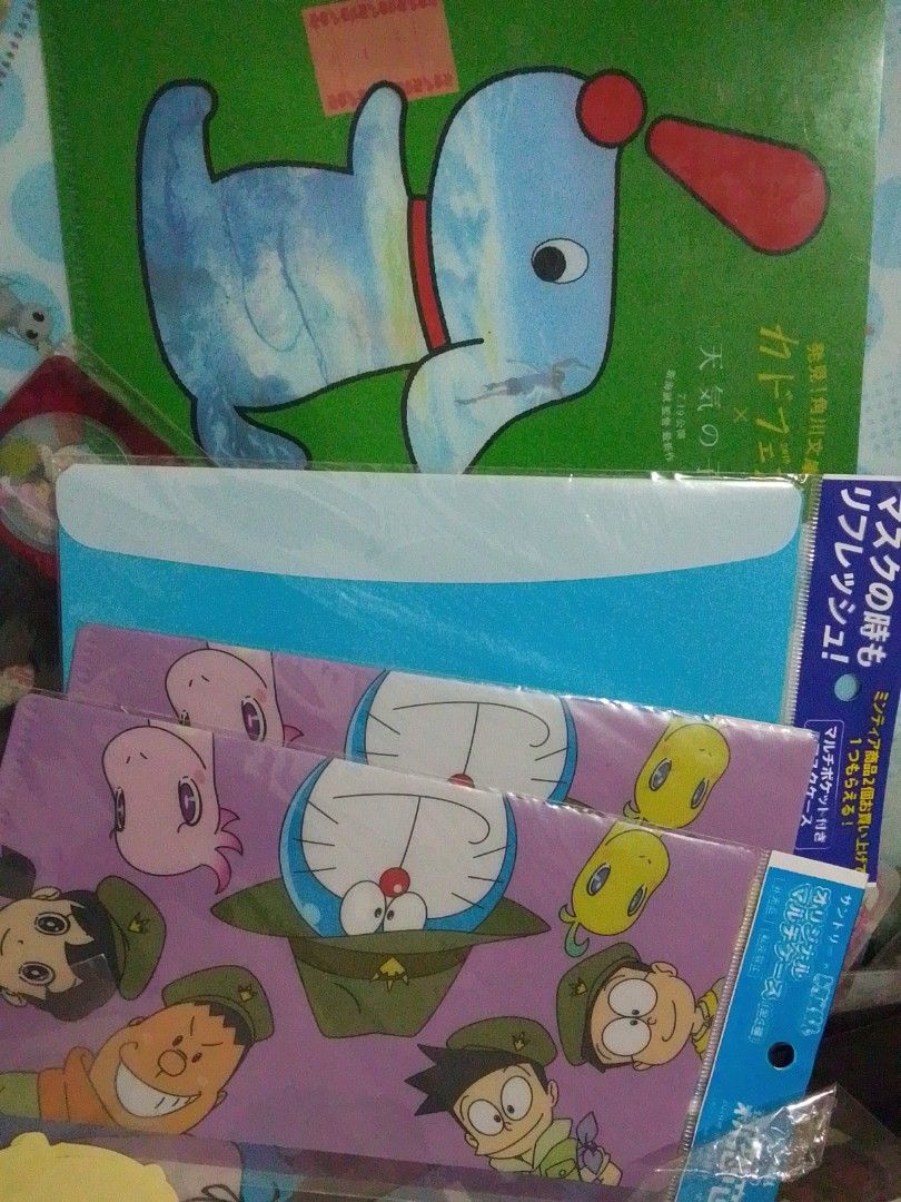 Doraemon Stationery Set (Category: Stationery & School Supplies) located in Santa Rosa. Submitted by animemerchcollection (Listing ID 1434576841, Image 1). Description: - Doraemon Stationery Set - Features Doraemon characters in military outfits - Includes a blue envelope - Comes with a green book with a cartoon dog - Related to a mask refresh promotion.