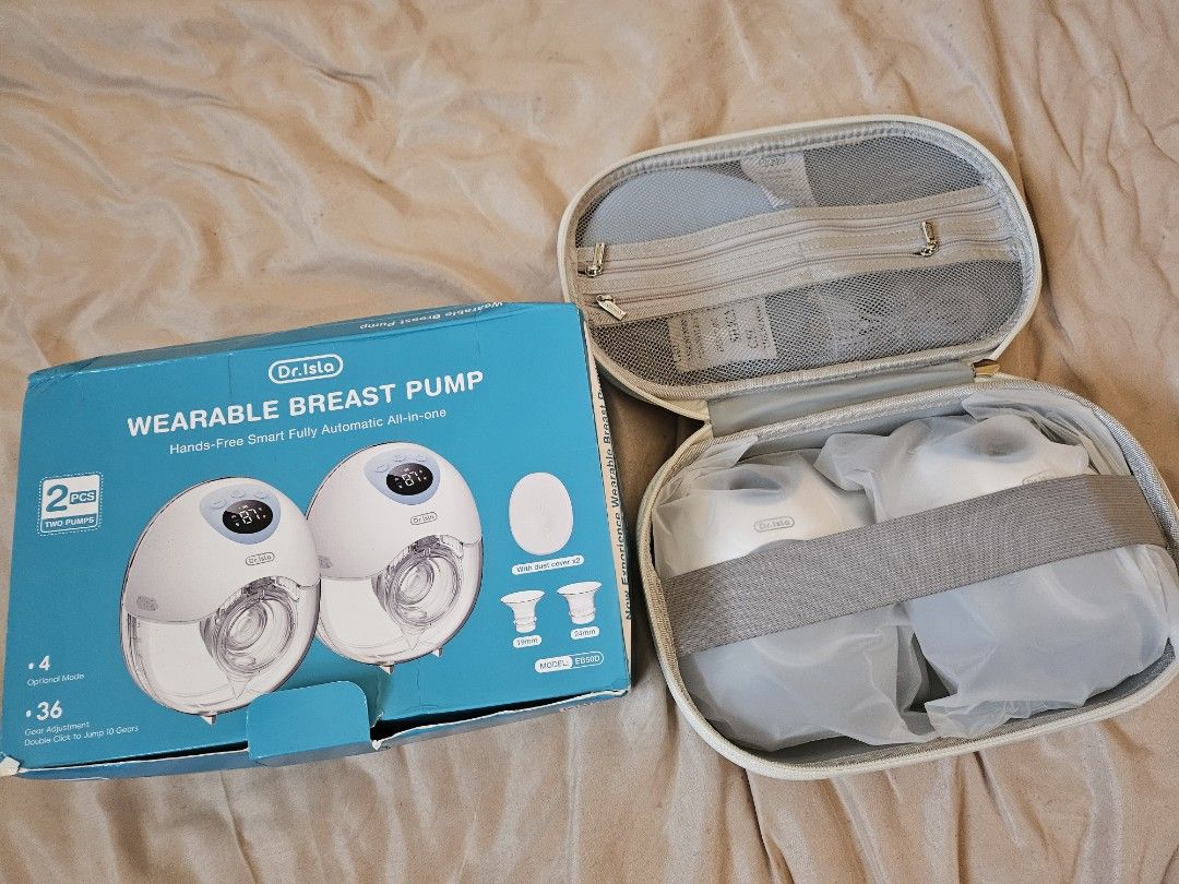 Dr. Isla 2pcs Wearable Breast Pump (Category: Breastfeeding & Bottle Feeding) located in Cavite. Submitted by great_stuffsph (Listing ID 1434389919, Image 1). Description: - Dr. Isla 2pcs Wearable Breast Pump - Hands-free and fully automatic - Includes two pumps - Comes with a carrying case and other accessories - Color: White - Original Price: ₱3,733 (after voucher).