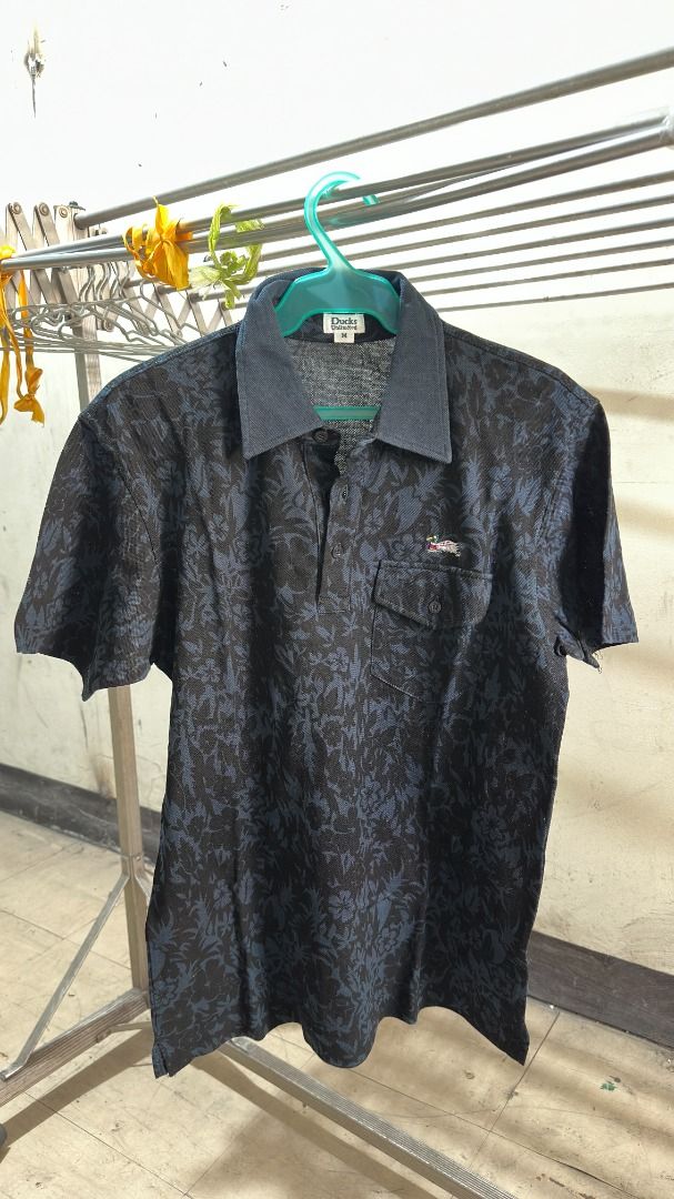 Ducks Unlimited Patterned Polo (Category: Tshirts & Polo Shirts ) located in Manila. Submitted by neilmatthewlua (Listing ID 1434436648, Image 1). Description: Pormang pang-gala o semi-formal! Selling this unique Ducks Unlimited Polo Shirt. Hindi ito yung generic na plain lang—may subtle floral print siya and very detailed yung embroidered logo. Bagay na bagay sa maong or slacks. Condition: 9/10 (Very Good Condition). Maayos ang collar, walang bu