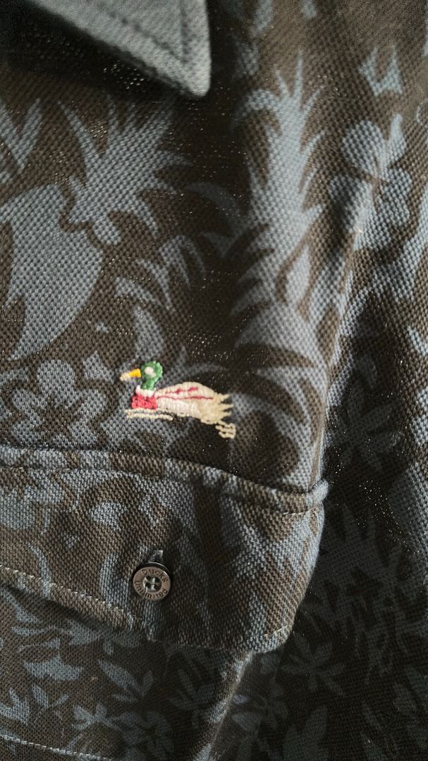 Ducks Unlimited Patterned Polo (Category: Tshirts & Polo Shirts ) located in Manila. Submitted by neilmatthewlua (Listing ID 1434436648, Image 2). Description: Pormang pang-gala o semi-formal! Selling this unique Ducks Unlimited Polo Shirt. Hindi ito yung generic na plain lang—may subtle floral print siya and very detailed yung embroidered logo. Bagay na bagay sa maong or slacks. Condition: 9/10 (Very Good Condition). Maayos ang collar, walang bu