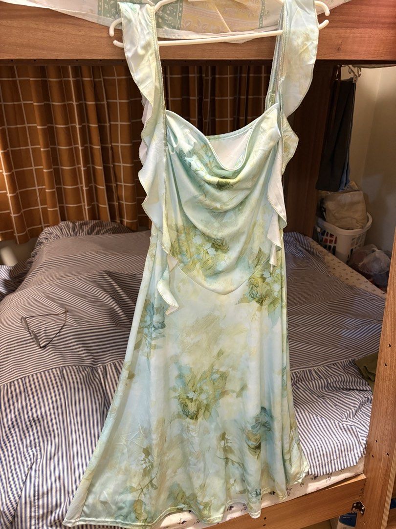Floral Print Maxi Dress (Category: Dresses) located in Manila. Submitted by taftshop (Listing ID 1434530901, Image 1). Description: - Floral maxi dress in green and white - Features a flattering, flowing skirt - Unique ruffle strap design - Ideal for special events or everyday wear - Ideal for waist: 27-29.