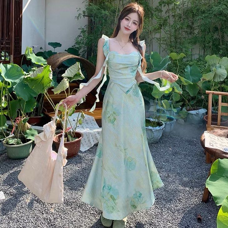 Floral Print Maxi Dress (Category: Dresses) located in Manila. Submitted by taftshop (Listing ID 1434530901, Image 2). Description: - Floral maxi dress in green and white - Features a flattering, flowing skirt - Unique ruffle strap design - Ideal for special events or everyday wear - Ideal for waist: 27-29.