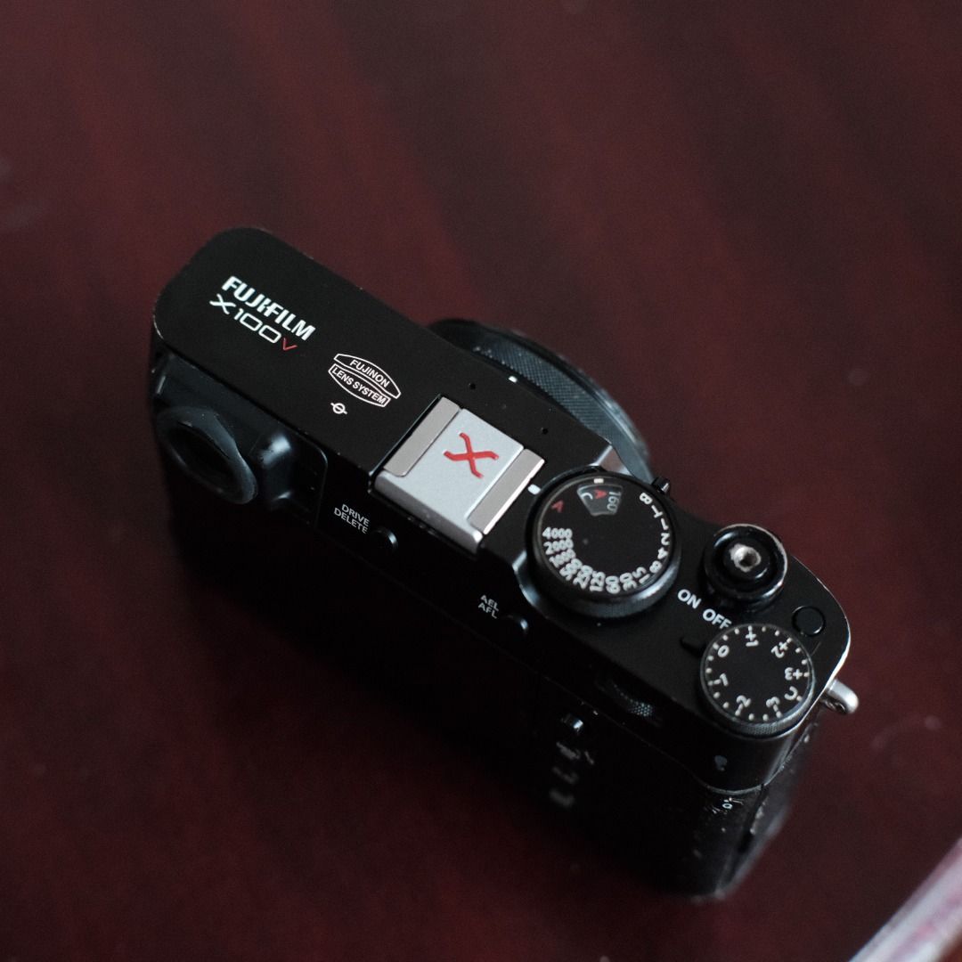 Fujifilm X100V (Category: Webcams) located in Makati City. Submitted by jmsobrevilla (Listing ID 1434499751, Image 3). Description: Fujifilm X100V (Black) Around 11,000 shutter count. No issues, works perfectly. Comes with: 2 batteries Memory card Leather half case Rubber full case Original Fujifilm charger Haoge front filter Hot shoe cover Camera strap Box The body has some paint fade from friction due to the rubber case, but no scratches or den
