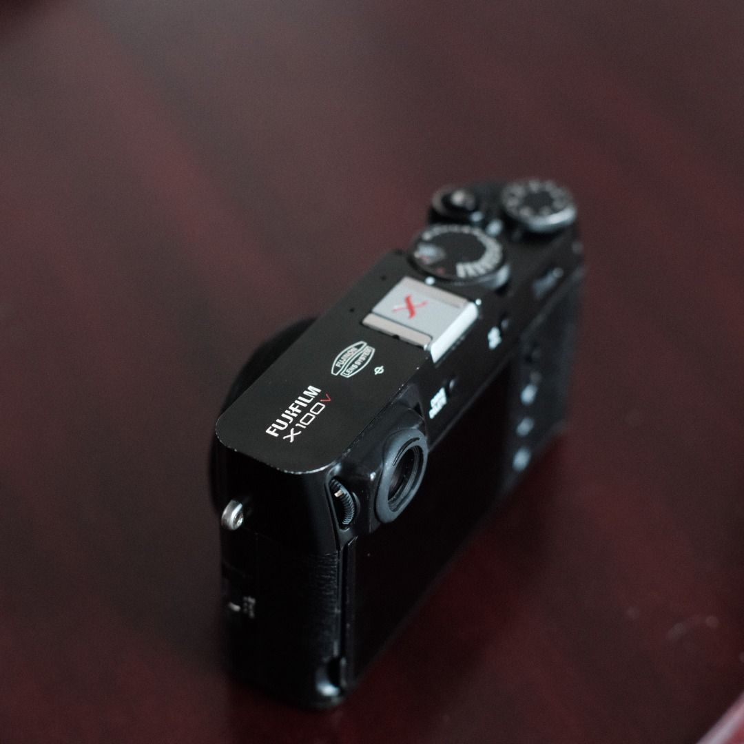 Fujifilm X100V (Category: Webcams) located in Makati City. Submitted by jmsobrevilla (Listing ID 1434499751, Image 2). Description: Fujifilm X100V (Black) Around 11,000 shutter count. No issues, works perfectly. Comes with: 2 batteries Memory card Leather half case Rubber full case Original Fujifilm charger Haoge front filter Hot shoe cover Camera strap Box The body has some paint fade from friction due to the rubber case, but no scratches or den