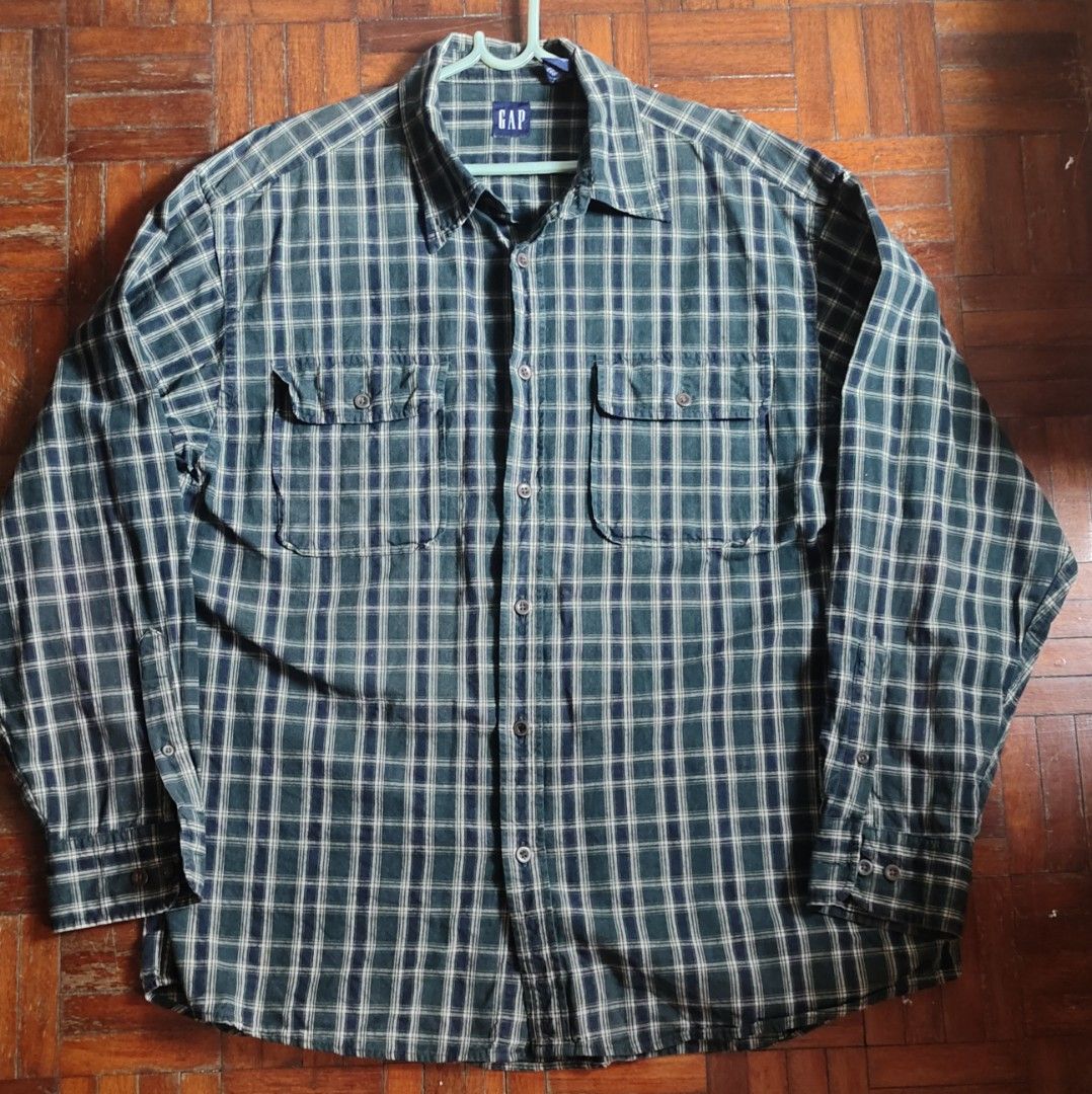 Kemeja GAP (Category: Formal Shirts) located in Puchong. Submitted by illifadli (Listing ID 1434397631, Image 1). Description: Kemeja GAP. Oversize. Pit 24, Labuh 30 Rm58 sahaja. Pos semenanjung +rm9 Condition kemeja elok. Dah 2 tahun tak pakai so nak clearkan apa ada dalam almari sebab ustaz cakap tak pakai nanti kena hisab. Ringkasan AI Carousell : - GAP button-up shirt - Green plaid pattern - Size: L - Material: 100% cotton - Features: Two che
