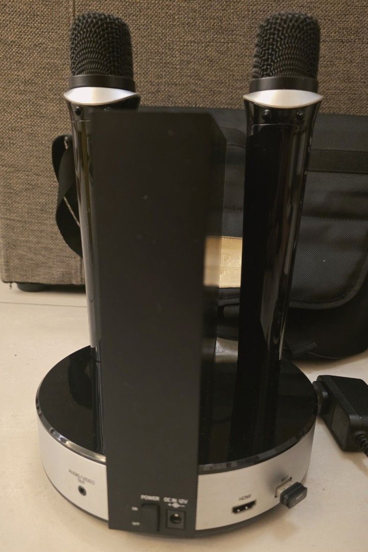 Grand Videoke Symphony 3 Pro Plus Karaoke System (Category: Entertainment Systems & Smart Home Devices) located in Pasig City. Submitted by eeioo (Listing ID 1434515744, Image 3). Description: Grand Videoke Symphony 3 Pro Plus karaoke system - Includes two microphones - Comes with remote control and song list - Power adapter included - Convenient carrying bag for easy transport - Stylish black and silver design - Features on the box highlight the