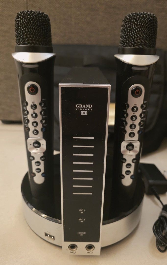 Grand Videoke Symphony 3 Pro Plus Karaoke System (Category: Entertainment Systems & Smart Home Devices) located in Pasig City. Submitted by eeioo (Listing ID 1434515744, Image 2). Description: Grand Videoke Symphony 3 Pro Plus karaoke system - Includes two microphones - Comes with remote control and song list - Power adapter included - Convenient carrying bag for easy transport - Stylish black and silver design - Features on the box highlight the