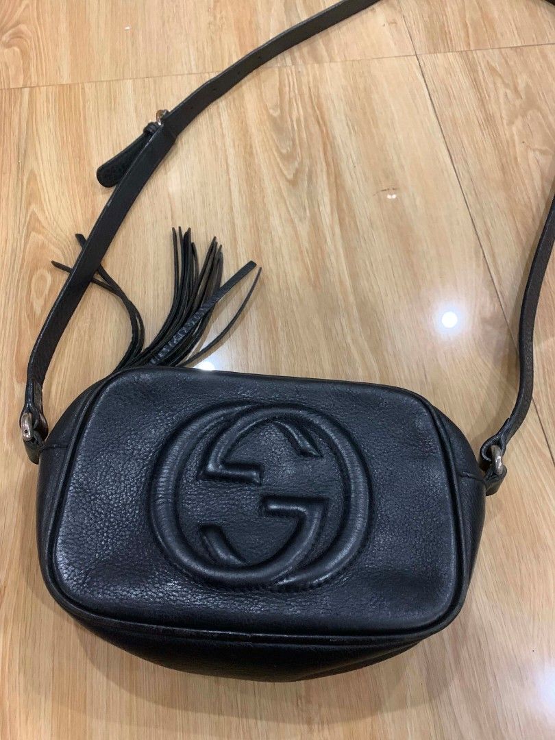 Gucci (Category: Luxury Bags & Wallets) located in Cuartero. Submitted by geobarredo (Listing ID 1433913686, Image 3). Description: Gucci Soho Disco Crossbody Bag • Elevate your everyday style with this timeless Gucci Soho Disco bag. • Crafted from premium black pebbled calfskin leather, it features the iconic embossed interlocking G logo and a playful tassel zipper pull. • Condition: Sign of usage 9/10 • Features: Adjustable crossbody strap, int