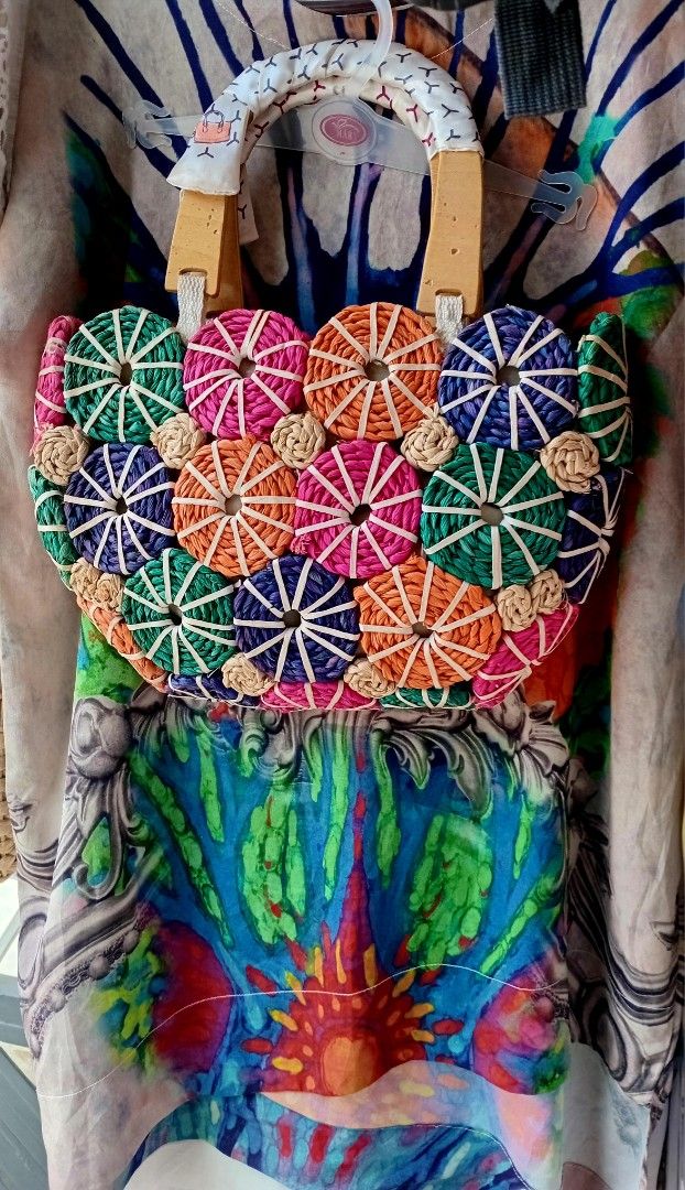 Handmade Woven Circle Handbag (Category: Purses & Pouches) located in Rodriguez. Submitted by maycol (Listing ID 1434574597, Image 1). Description: - Unique woven handbag - Features colorful circular patterns - Wooden and woven handle - Vibrant colors: green, pink, orange, blue - Perfect accessory for any outfit -+the summer top M-XL P200.00.