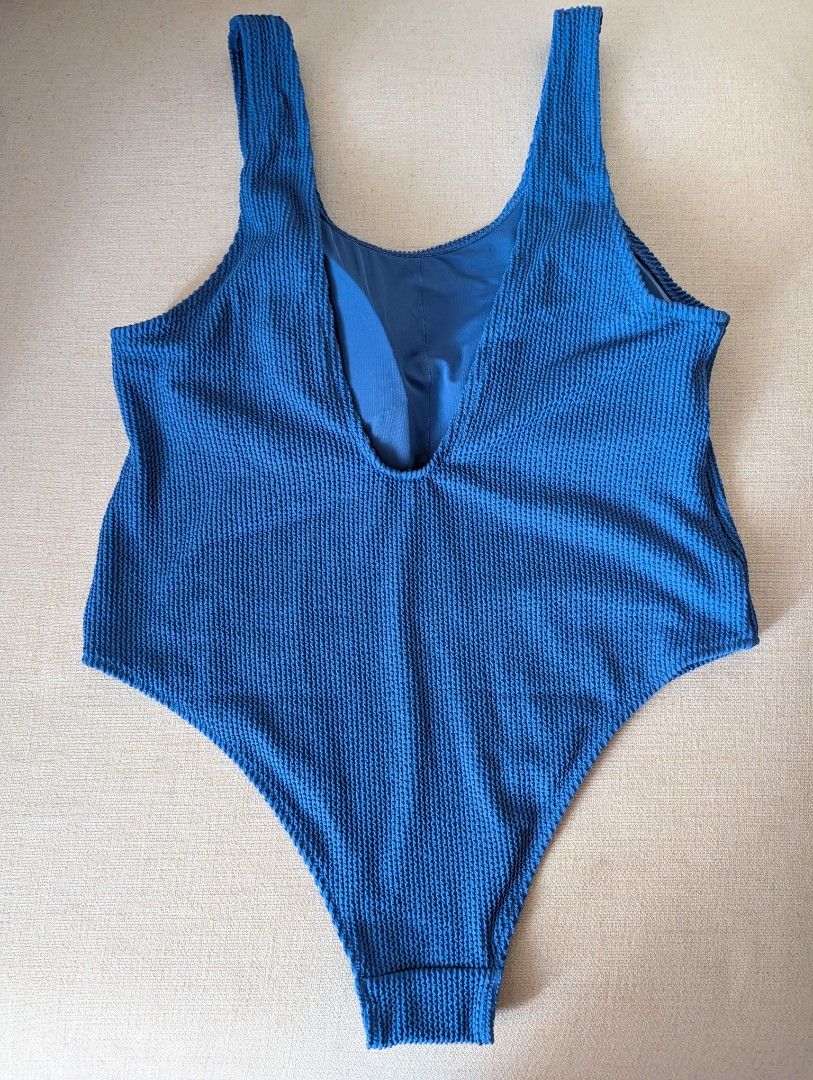 H&M Blue Textured Swimsuit XL (Category: Bikinis & Swimsuits) located in Manila. Submitted by cart_rd (Listing ID 1434486178, Image 2). Description: - H&M Blue Swimsuit - Size: XL - Design: One-piece with scoop neckline - Fabric: Textured - Material: Shell - 92% Recycled Polyester, Lining - 88% Recycled Polyester - Sustainable and stylish choice.