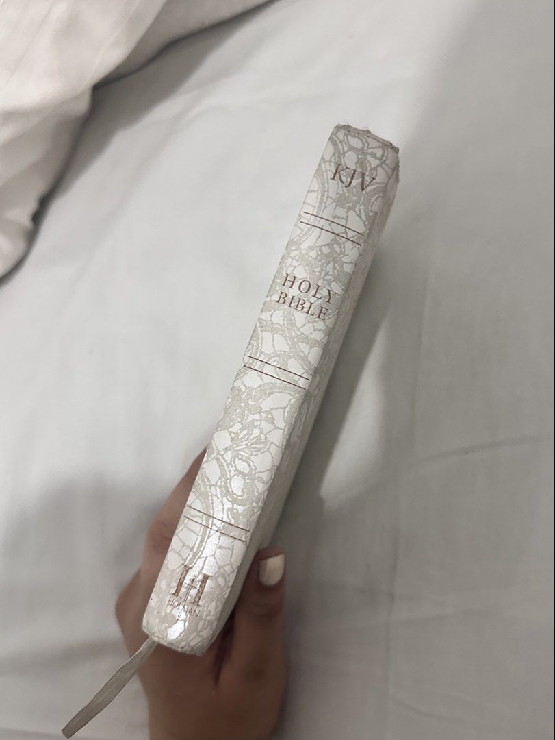 Holy Bible King James Version (KJV) (Category: Religion Books) located in Las Pinas. Submitted by beachfairy (Listing ID 1434536636, Image 2). Description: - White lace-patterned cover - King James Version - Contains a page for recording marriage certificate CONDITION: - Some staining (as seen in photos) - Stains are on cover and intro pages only. Scripture pages are still clean .