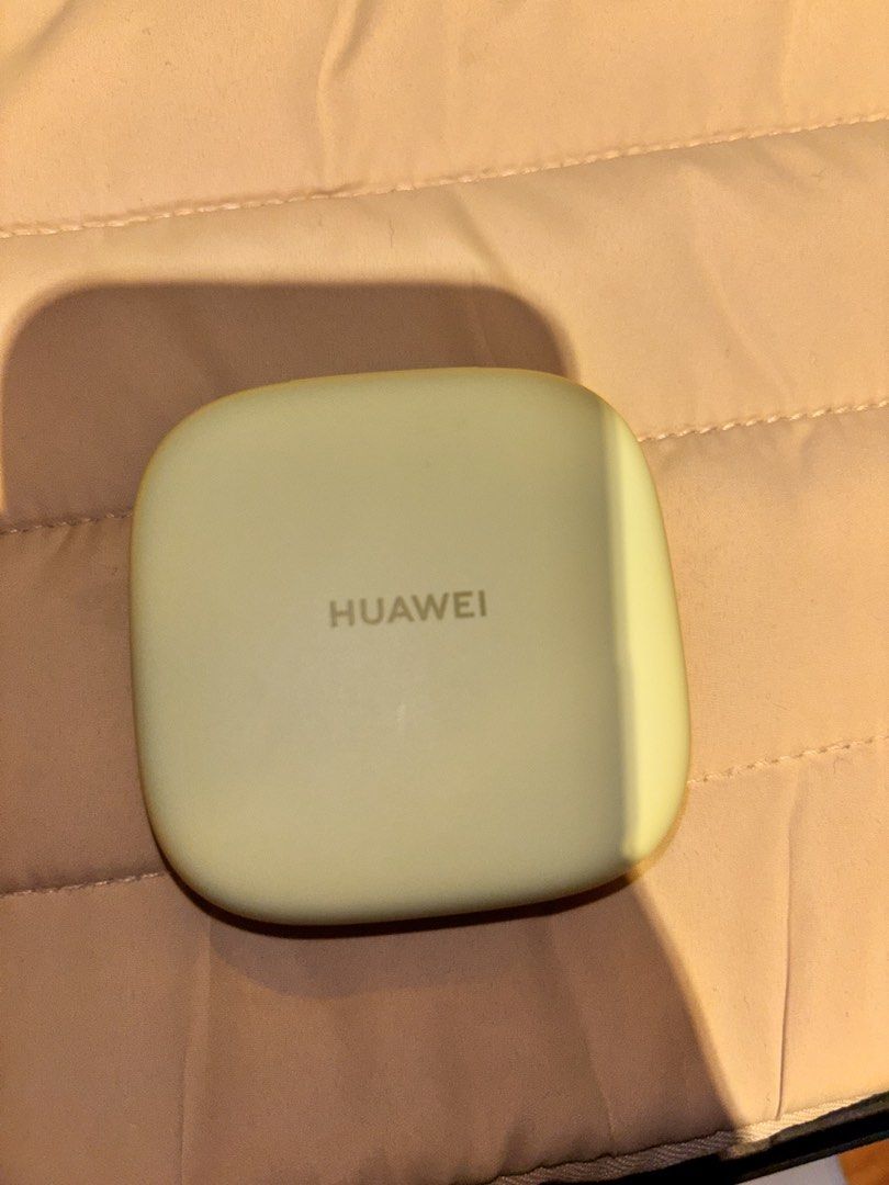 Huawei FreeArc Earphones (Category: Earphones) located in Manila. Submitted by keiii00028 (Listing ID 1434536087, Image 1). Description: - Huawei FreeArc earbuds - Light green color - Includes charging case - Unique design - Huawei logo on case - Model name visible - Technical specifications printed on case.