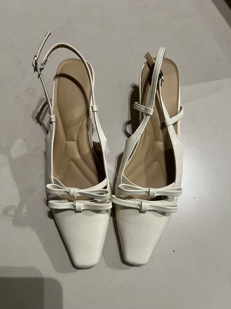 Hue Poppy in Creme (Category: Heels) located in Pasig City. Submitted by decluttermycloset.24 (Listing ID 1434555655, Image 2). Description: - Hue Poppy in Creme - Material: Premium patent leather - Heel height: 1.5 inches - Insole: Ergonomic soft cushion - No longer available on website - Minor flaw (see last pic) but can be fixed with superglue - Super comfy! Slightly negotiable.