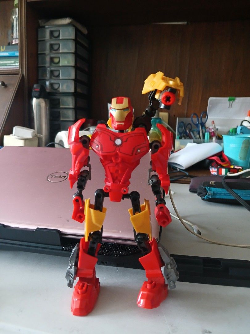Iron Man LEGO (Category: Lego & Building Sets) located in Quezon City. Submitted by lorenzomarcalain (Listing ID 1434455855, Image 1). Description: - Red and yellow color scheme - Features articulated limbs - Includes a detailed Iron Man helmet - Assembled and ready for play - Perfect for superhero or Bionicle collectors.