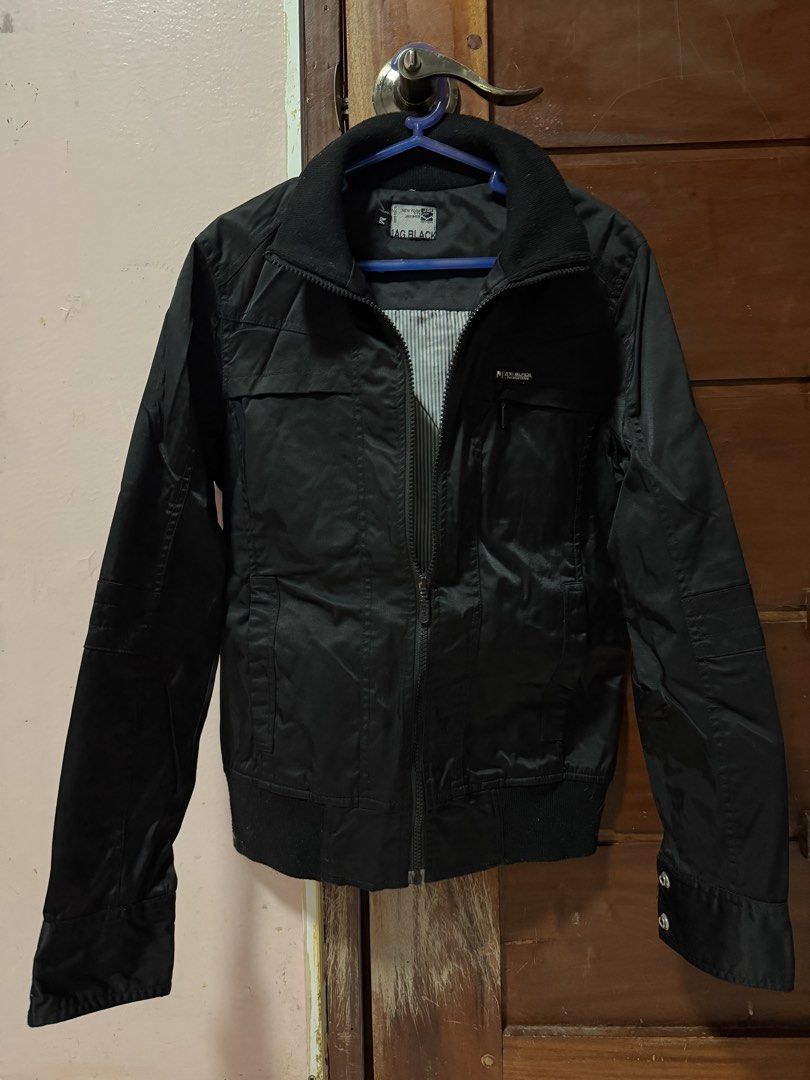 JAG BLACK Jacket (Category: Coats, Jackets and Outerwear) located in Kawit. Submitted by thoris (Listing ID 1434423260, Image 2). Description: - Unisex - Medium size - Full zip closure - Collared neckline - Buttoned cuffs - Striped lining - With extra pocket inside - Plain back.