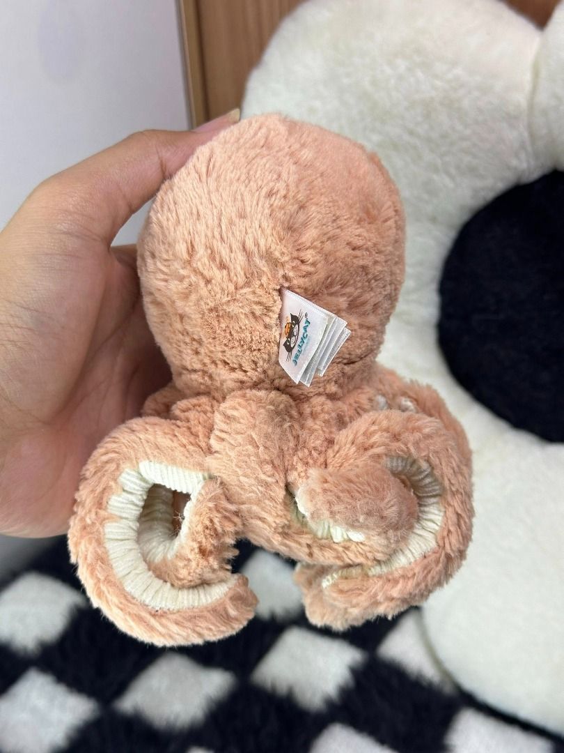 Jelly Cat Amuseables : Odell Octopus Baby Tiny (Category: Plushies & Soft Toys) located in Quezon City. Submitted by genie.fluff (Listing ID 1434594842, Image 2). Description: TINY SIZED: 5-6IN With tags and Serial CODE : JELLY8174SH ✬✬CERTIFIED GENUINE AND AUTHENTIC BY JELLYCAT COLLECTORS✬✬ This adorable plush is the Odell Octopus from Jellycat London. Its signature features include eight stretchy, curly tentacles with a cozy cordy underside and