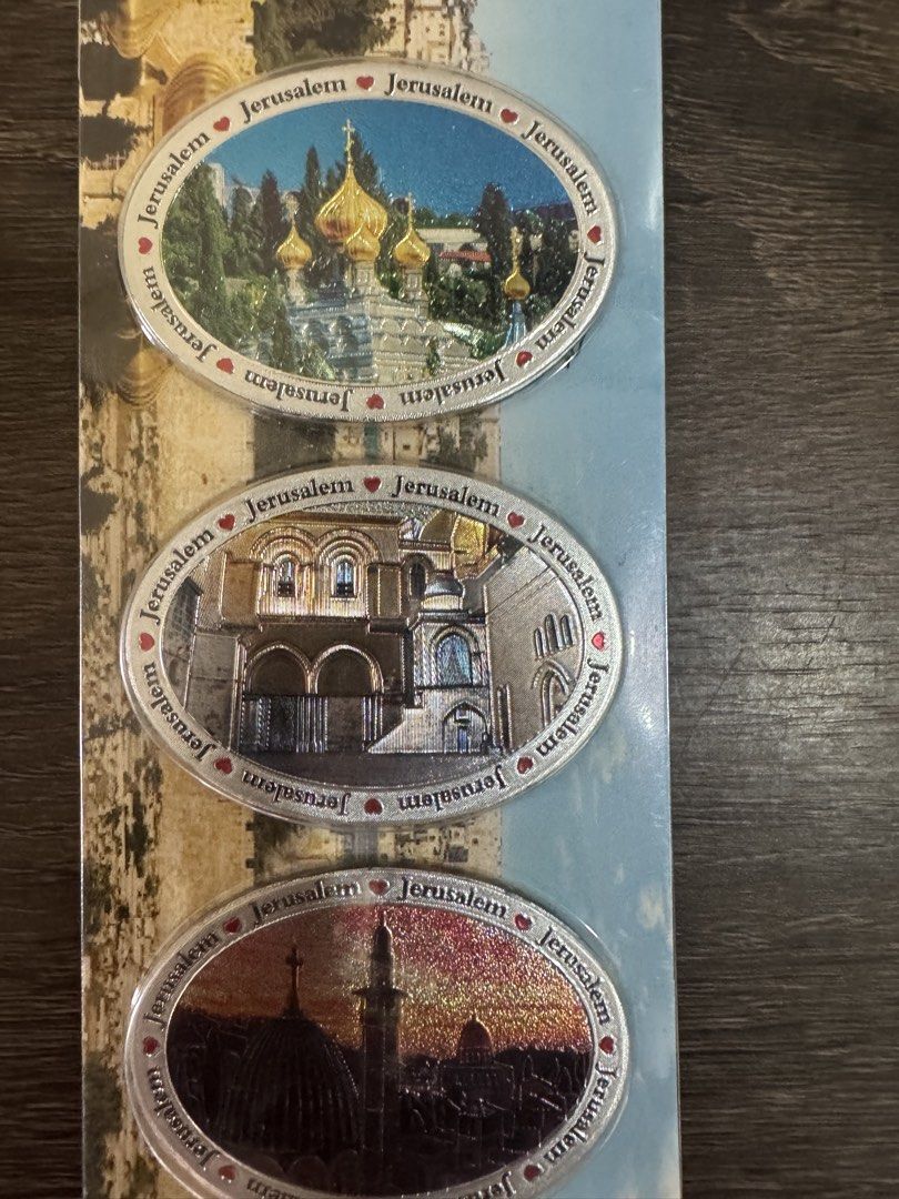 Jerusalem 3-Piece Magnet Set (Category: Vintage Collectibles) located in Davao. Submitted by pilmarmustdeclutter (Listing ID 1434394378, Image 1). Description: Set of three oval-shaped magnets featuring Jerusalem landmarks. Each magnet has a different image, including a building with golden domes, an arched building, and a cityscape with a dome. The magnets are in a sealed package, ready to be displayed on your fridge or any magnetic surface. 150