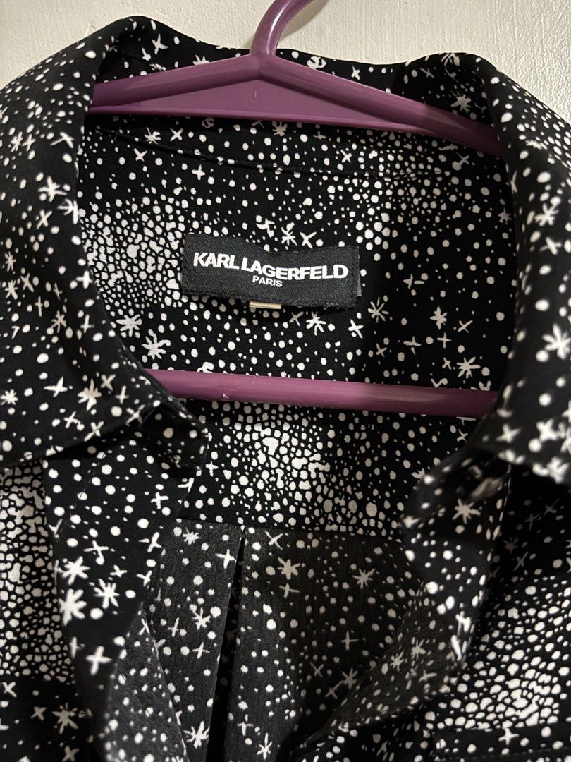 Karl Lagerfeld Paris Star Print Blouse (Category: Shirts) located in Las Pinas. Submitted by k.manille (Listing ID 1434517148, Image 3). Description: - Karl Lagerfeld Blouse - fits until semi xl until 38 bust - Unique star print design - Classic collared neckline - Long sleeves - Button-down closure - Features two chest pockets - Subtle brand logo on collar - Black shirt with white star pattern #carousave2026.