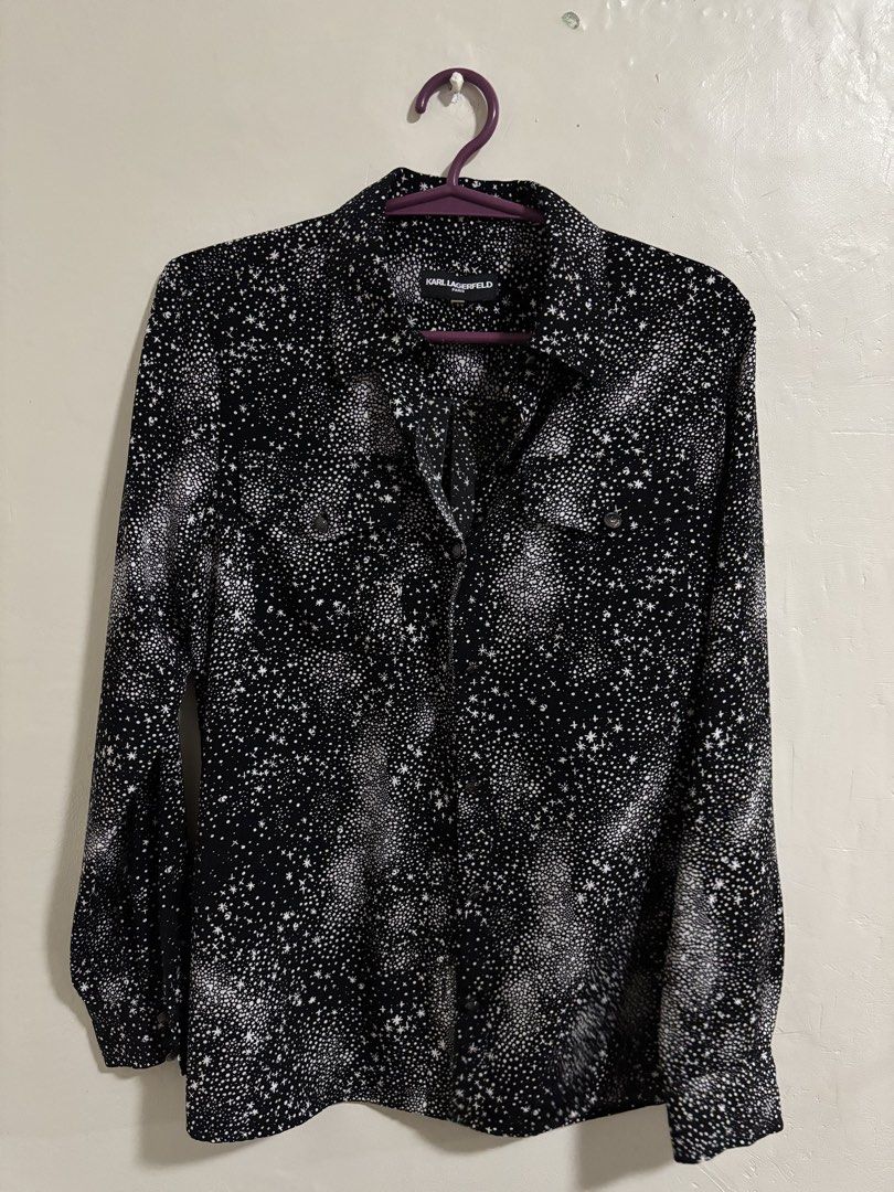 Karl Lagerfeld Paris Star Print Blouse (Category: Shirts) located in Las Pinas. Submitted by k.manille (Listing ID 1434517148, Image 1). Description: - Karl Lagerfeld Blouse - fits until semi xl until 38 bust - Unique star print design - Classic collared neckline - Long sleeves - Button-down closure - Features two chest pockets - Subtle brand logo on collar - Black shirt with white star pattern #carousave2026.