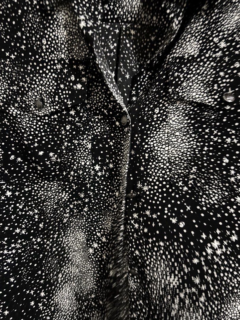 Karl Lagerfeld Paris Star Print Blouse (Category: Shirts) located in Las Pinas. Submitted by k.manille (Listing ID 1434517148, Image 2). Description: - Karl Lagerfeld Blouse - fits until semi xl until 38 bust - Unique star print design - Classic collared neckline - Long sleeves - Button-down closure - Features two chest pockets - Subtle brand logo on collar - Black shirt with white star pattern #carousave2026.