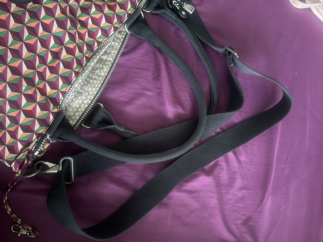 Kipling Geometric Print Handbag (Category: Tote Bags) located in Quezon City. Submitted by assdeclutters (Listing ID 1434405145, Image 3). Description: - Stylish Kipling handbag - Geometric pattern design - Detachable shoulder strap - Includes Kipling monkey keychain - Interior lining with some wear - Secure zipper closure - Ideal for daily use.