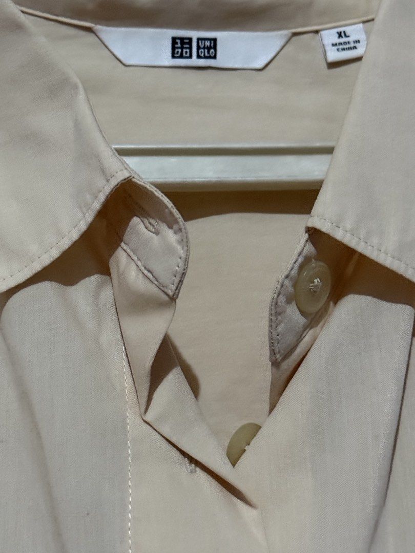 Light Orange Uniqlo Short-Sleeved Button-Down Shirt (Category: Shirts) located in Quezon City. Submitted by ayahko (Listing ID 1434435108, Image 2). Description: Uniqlo light orange short-sleeved button-down shirt/polo.