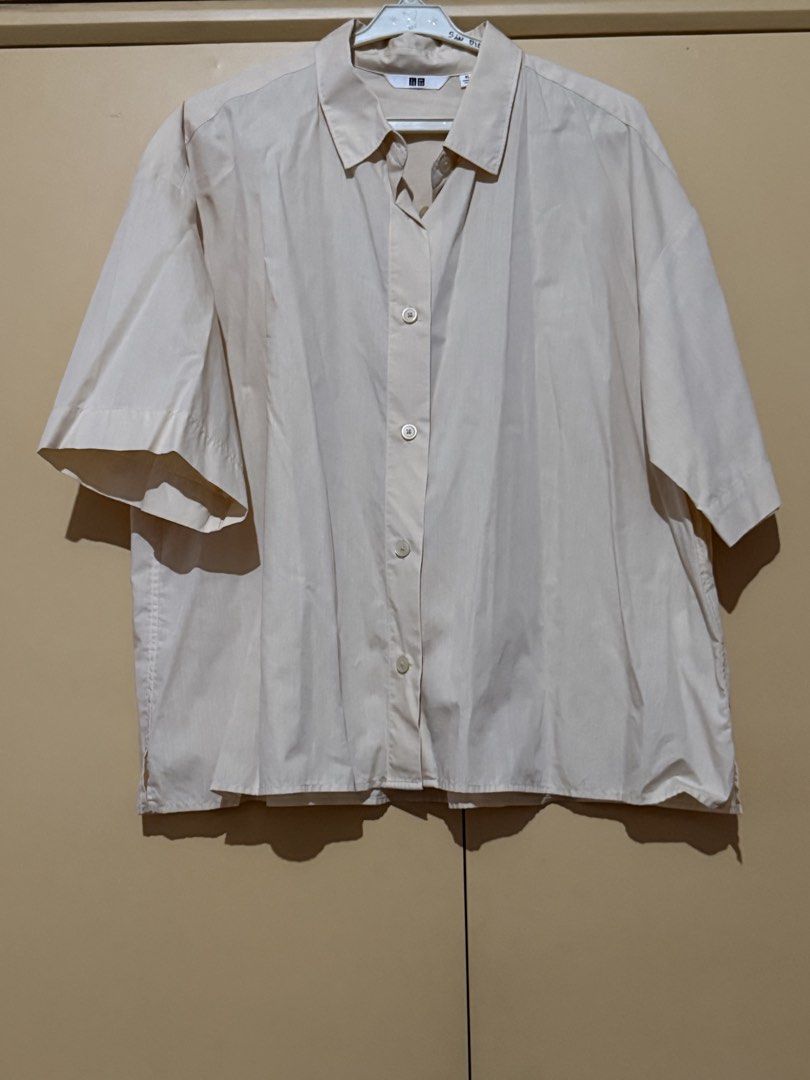 Light Orange Uniqlo Short-Sleeved Button-Down Shirt (Category: Shirts) located in Quezon City. Submitted by ayahko (Listing ID 1434435108, Image 1). Description: Uniqlo light orange short-sleeved button-down shirt/polo.