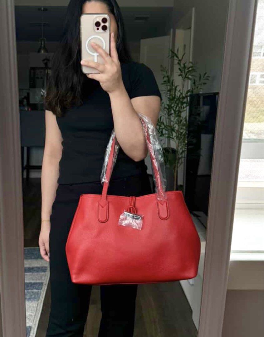 Longchamp Roseau Leather Tote Bag - Red (Category: Luxury Bags & Wallets) located in San Fernando. Submitted by currency_sy (Listing ID 1414810250, Image 3). Description: - Authentic Longchamp Roseau tote bag - Classic red color - Bamboo-style closure - Made of textured leather - Two top handles - Spacious interior.