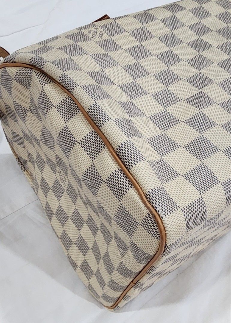 Louis Vuitton Damier Ebene Speedy 30 (Category: Luxury Bags & Wallets) located in Butuan. Submitted by sofiaharmonie (Listing ID 1434452241, Image 3). Description: - Authentic Louis Vuitton Speedy 30 handbag - Damier Ebene canvas - Iconic checkered pattern - Gold-tone hardware - Top zipper closure - Spacious interior - Nice Patina on handles and leather trim - Pristine interiors -Excellent condition - Made in France.