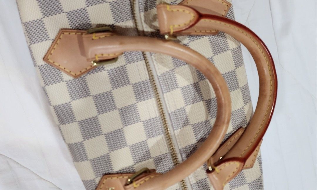 Louis Vuitton Damier Ebene Speedy 30 (Category: Luxury Bags & Wallets) located in Butuan. Submitted by sofiaharmonie (Listing ID 1434452241, Image 2). Description: - Authentic Louis Vuitton Speedy 30 handbag - Damier Ebene canvas - Iconic checkered pattern - Gold-tone hardware - Top zipper closure - Spacious interior - Nice Patina on handles and leather trim - Pristine interiors -Excellent condition - Made in France.