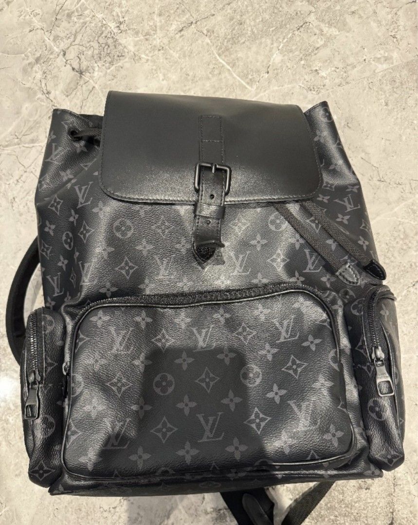 Louis Vuitton Monogram Eclipse Backpack (Category: Bags & Wallets) located in Singapore. Submitted by jpcy909 (Listing ID 1434442246, Image 1). Description: - Authentic Louis Vuitton Monogram Eclipse backpack. - Secure flap closure with buckle and drawstring. - Multiple pockets for organization. - Adjustable shoulder straps for a comfortable fit. - Ideal for everyday use and travel..