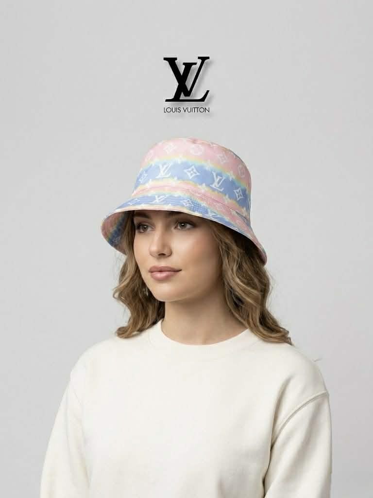 Louis Vuitton Rainbow Tie-Dye Monogram Bucket Hat (Category: Luxury Accessories) located in Cebu City. Submitted by westleygics18 (Listing ID 1434512515, Image 2). Description: Louis Vuitton Rainbow Tie-Dye Monogram Bucket Hat - Excellent Condition - Pastel rainbow tie-dye background with white signature monogram symbols. - Style: Classic bucket hat silhouette. - Material: Lightweight, smooth-finish fabric. - Interior: Solid white lining. Dm me f